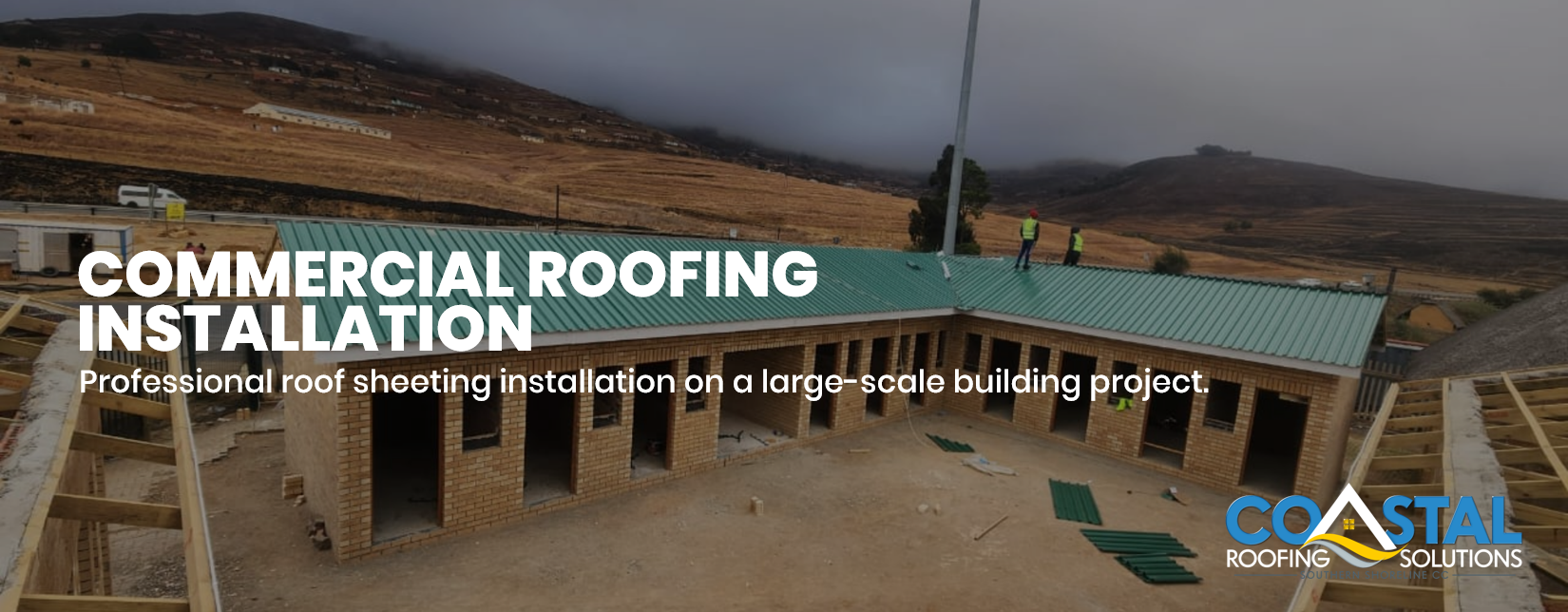 Commercial Roof Sheeting Installation by Coastal Roofing Solutions Large commercial building with professionally installed green roof sheeting by Coastal Roofing Solutions during construction in KwaZulu-Natal, South Africa.