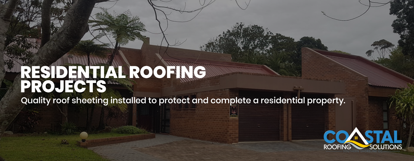 Completed Residential Roof Sheeting Installation on Brick Home A completed residential roof sheeting installation by Coastal Roofing Solutions, enhancing the home's appearance while providing long-lasting weather protection and durability.