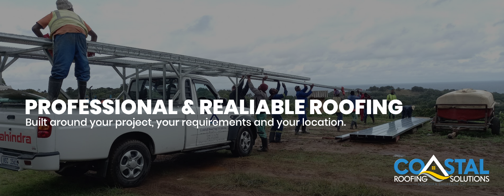 Steel Roof Truss Installation by Coastal Roofing Solutions Coastal Roofing Solutions team installing steel roof trusses using a branded work vehicle at a construction site in Port Edward, KwaZulu-Natal.